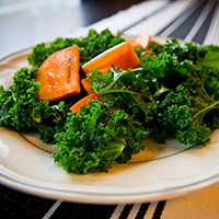 Kale, persimmon, almond salad with lime and honey vinaigrette